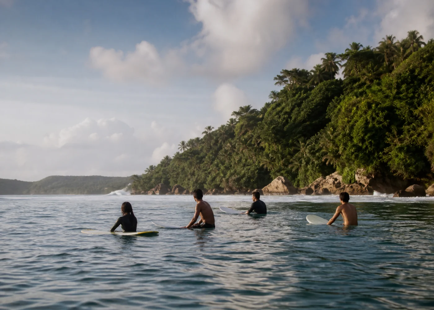 Surfer paddling through an Indonesian lineup